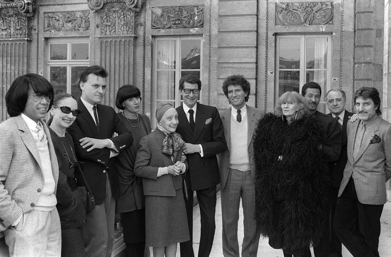 Issey Miyake, third from right, with (from left) fashion designers Kenzo, Anne-Marie Beretta, Jean-Charles de Castelbajac, Chantal Thomass, Alix Gres, Yves Saint-Laurent, then French Minister of Culture Jack Lang, fashion designers Sonia Rykiel, Pierre Berge and Emanuel Ungaro, in 1984. AFP