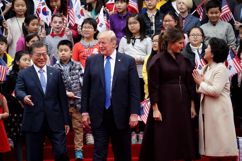 Left to right, South Korean president Moon Jae-in, US president Donald Trump, US first lady Melania Trump and South Korean first lady Kim Jung-Sook attend the welcoming ceremony at the presidential Blue House in Seoul, South Korea. Chung Sung-Jun / EPA