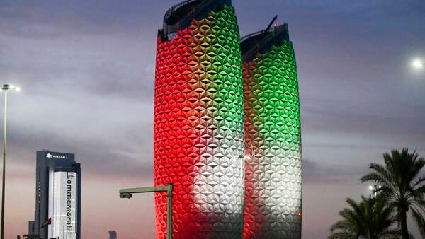 Al Bahr Towers in Abu Dhabi are lit up to mark the UAE's 51st National Day. Their innovative design and unique dynamic modular shading system provides self-shading as the Sun moves around the building. Khushnum Bhandari / The National