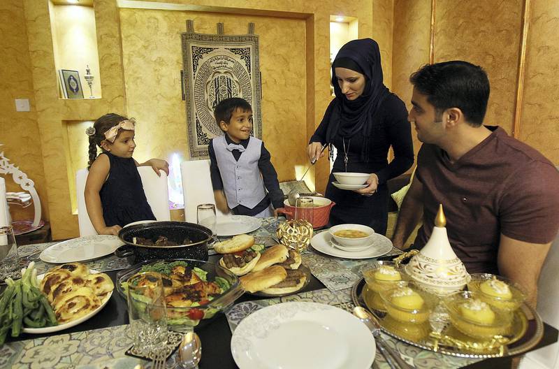 Dubai, May 21, 2018: Muaz Hawari with his  wife Nedina Mehmedovic  son Ammar and daughter Laila breaking their fast at their residence in Dubai. Satish Kumar for the National / Story by Hala Khalaf