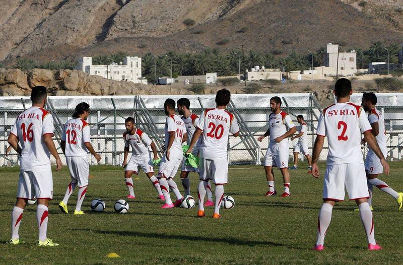 Syria football players shown during a training session on Tuesday in Muscat ahead of their 2018 World Cup qualifying match against Japan in the Omani capital on Thursday night. Mohammed Mahjoub / AFP
