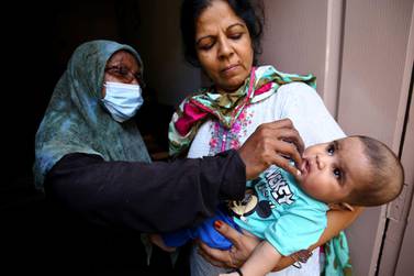 A health worker administers polio vaccine to children in a door-to-door campaign in Karachi, Pakistan on 23 September. Pakistan is one of the last two countries, along with Afghanistan, where polio is still an endemic. EPA