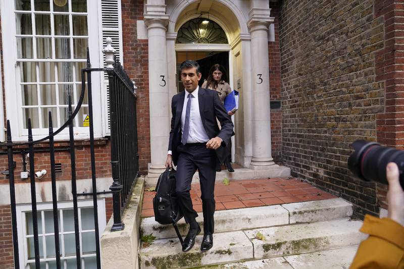 Conservative Party leadership candidate Rishi Sunak leaves the campaign office in London. AP