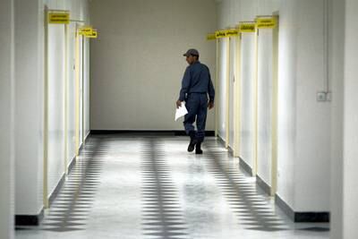 TXTG8J File photo shows an Iranian soldier walking in a corridor of Evin prison during a journalist's visit to the prison in Tehran, Iran on June 13, 2006. Esha Momeni, 28, an Iranian-American student from Los Angeles is imprisoned in Tehran and is not being allowed to talk to her family, her attorney says. Momeni, described as a researcher looking into the status of women in Iran, was pulled over for a traffic infraction in Tehran on October 15 and is now being held at the notorious Evin prison. Momeni has been allowed one phone conversation since her arrest, which her attorney says may have been re