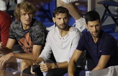 epa08485621 (L-R) Alexander Zverev of Germany,Grigor Dimitrov of Bulgaria and Novak Djokovic of Serbia watch the final match between Filip Krajinovic of Serbia and Dominic Thiem of Austria at the Adria Tour tennis tournament in Belgrade, Serbia, 14 June 2020. The Adria Tour will be held until 05 July in a number of Balkan countries.  EPA/ANDREJ CUKIC