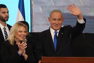 Former Israeli prime minister and leader of the Likud party Benjamin Netanyahu and his wife Sara greet supporters in Jerusalem as Israelis went to the polls on Tuesday. EPA