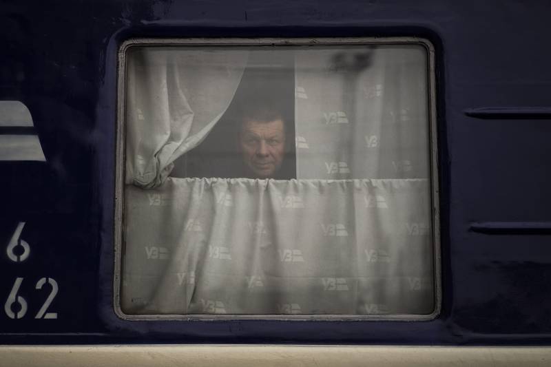 A man looks out from a train, at the railway station in Lviv, Ukraine. The UN has estimated the conflict could produce as many as four million refugees. AP