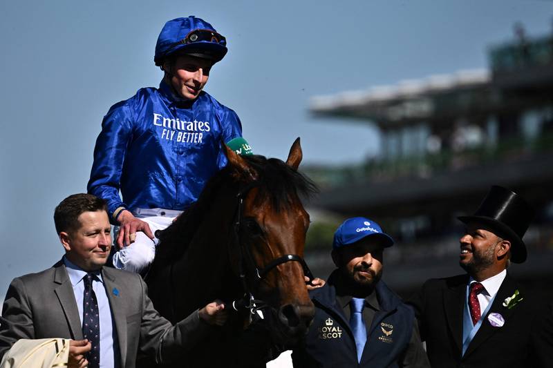 Jockey William Buick celebrates after winning The St James' Palace Stakes on Coroebus. AFP