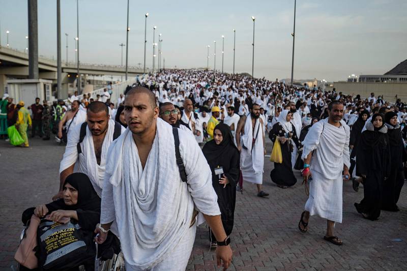 Thousands of pilgrims make their way across the valley of Mina, near Makkah, to perform the stoning of the devil ritual which marks the start of the Eid Al Adha holiday. AFP