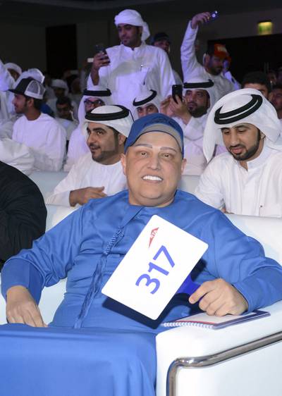 Dubai-based Indian businessman Balwinder Sahani, centre,  looks on during an auction in Dubai on October 8, 2016. He paid Dh33m for a Dubai licence plate bearing the number 5. AFP