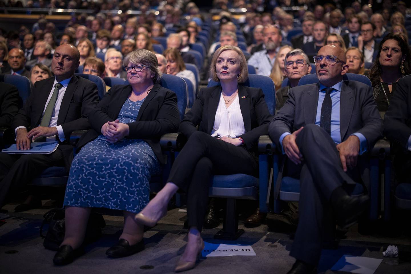 British Prime Minister LIz Truss, centre, and members of her Cabinet look on as Kwasi Kwarteng makes his keynote speech, which received lukewarm support. EPA