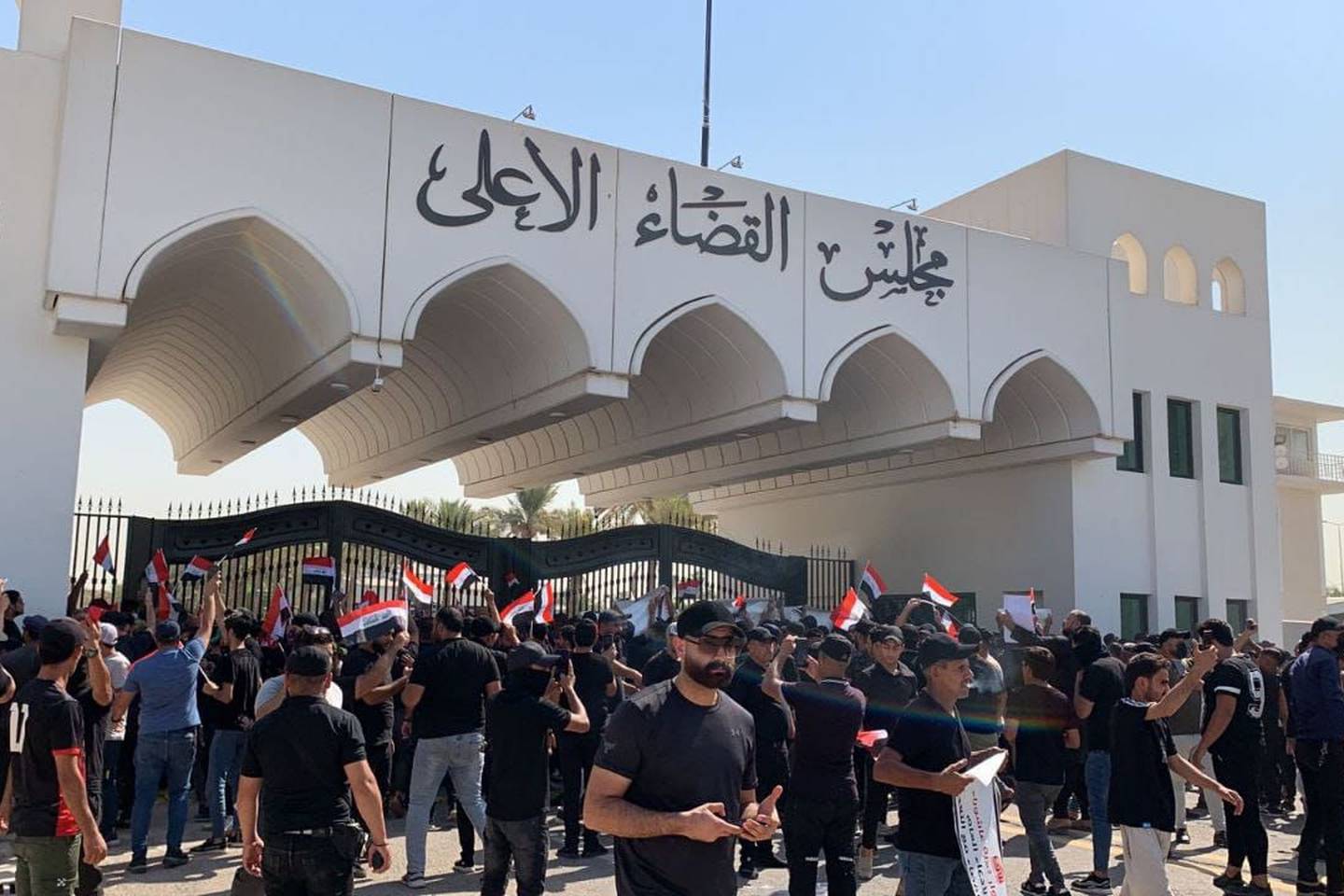 Supporters of Iraq's Shiite cleric Moqtada Al Sadr gather outside Supreme Judiciary Council building