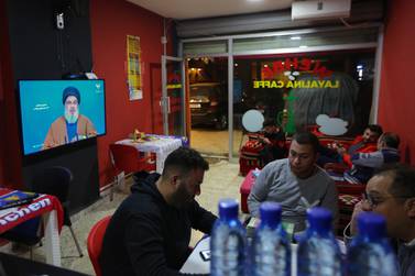 Lebanese men listen to Secretary-General of Hezbollah Sayyed Hassan Nasrallah during his speech on Al-Manar TV screen where he spoke about the latest political developments in Lebanon at a coffeshop in Beirut. EPA
