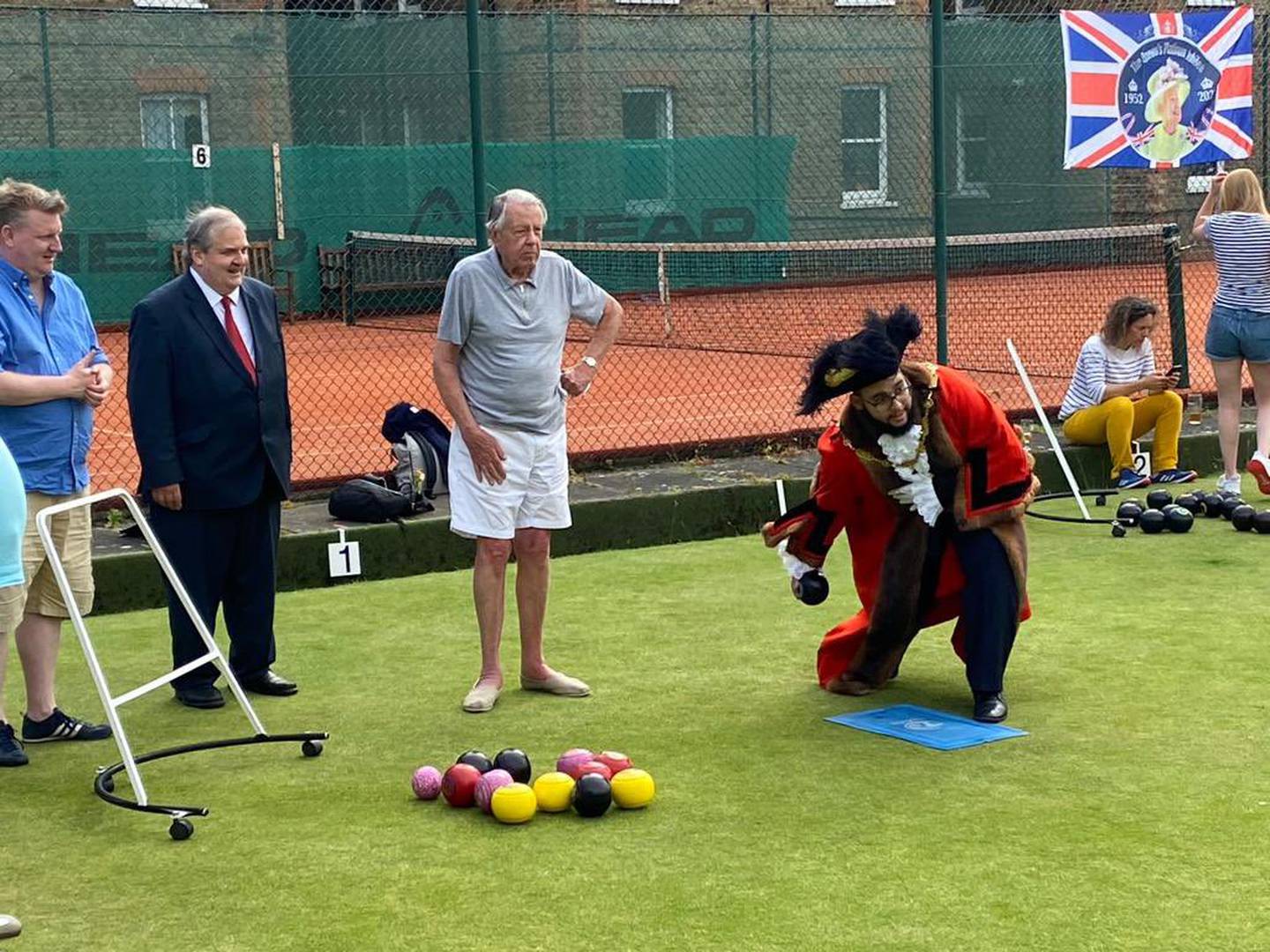 Taouzzale, above playing lawn bowls with members of the Paddington Sports Club, has made it his mission to attend as many events as possible in his 12-month tenure. Ninety-three or so days in, the tally stands at almost 300. Photo: Westminster City Council