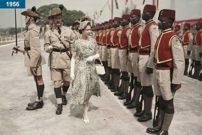 1956: The queen inspects the Queen's Own Nigeria Regiment, at Kaduna Airport, Nigeria, during her Commonwealth tour.