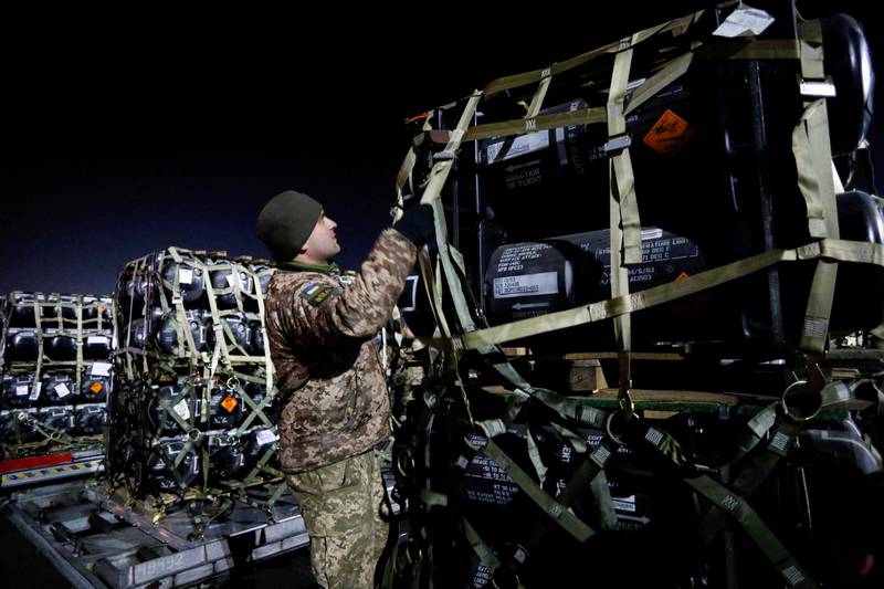 A Ukrainian service member unpacks Javelin anti-tank missiles, delivered by plane as part of the US military support package. Reuters
