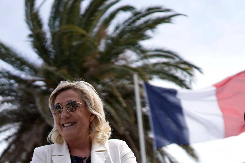 Far-right leader Marine le Pen smiles as he visits a divers school in Frejus, southern France, Thursday, June 17, 2021. Although the winner of Sundays June 20 and 27 in the regional elections will only deal with local issues, Marine Le Pen's Rassemblement National (National Rally) party could for the first time capture one of France's 13 regions. (AP Photo/Daniel Cole)