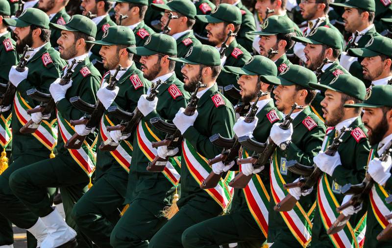 (FILES) In this file photo taken on September 22, 2018 shows members of Iran's Revolutionary Guards Corps (IRGC) marching during the annual military parade which markins the anniversary of the outbreak of the devastating 1980-1988 war with Saddam Hussein's Iraq, in the capital Tehran. Iran's top security body called an urgent meeting on January 3, 2020 over the "martyrdom" of Quds Force commander Qasem Soleimani by the United States in Baghdad, semi-official news agency ISNA reported. The United States announced earlier that it had killed the commander of the Islamic republic's Quds Force, Qasem Soleimani, in a strike on Baghdad's international airport early on Friday. / AFP / afp / STRINGER
