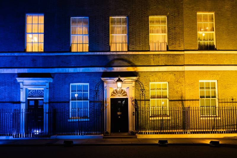 No 10 Downing Street in London is lit blue and yellow in solidarity with Ukraine after the Russian invasion. EPA