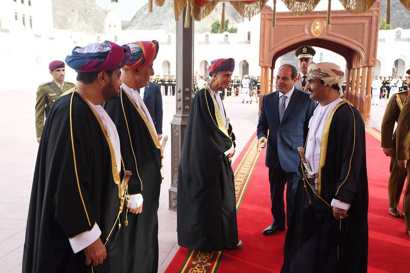 Mr El Sisi greets Omani officials.