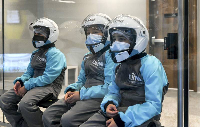 Abu Dhabi, United Arab Emirates - Young boys awaiting their turn for the indoor skydiving adventure at CLYMB, Yas Island. Khushnum Bhandari for The National