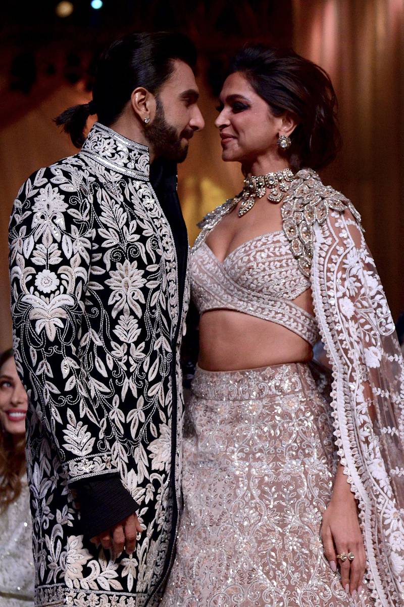 Married couple Ranveer Singh and Deepika Padukone shared a kiss on the catwalk.