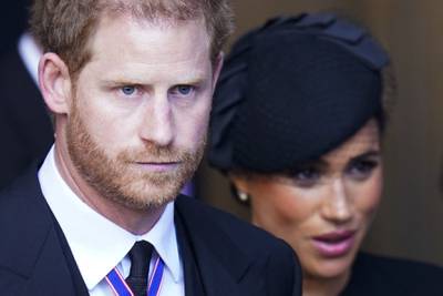 Britain's Prince Harry, Duke of Sussex, and his wife Meghan leave after a funeral service for Queen Elizabeth II in London. AFP