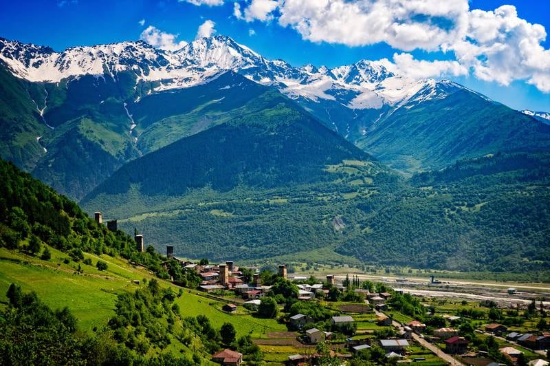 Panoramic view of Mestia village in Svaneti region of Georgia with its medieval stone towers and the Caucasus mountains in the background - June 29, 2017