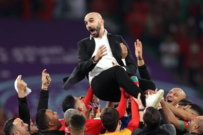 Walid Regragui, coach of Morocco, celebrates with the team. Getty