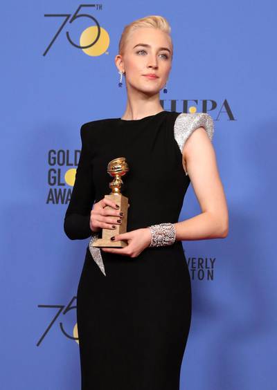 Saoirse Ronan holds the award for Best Performance by an Actress in a Motion Picture Musical or Comedy in Lady Bird. EPA