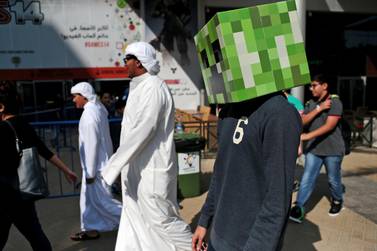 Abu Dhabi, United Arab Emirates, September 12, 2014:      A boy dressed as a block from the game Minecraft enters GamesME '14 at the World Trade Centre in Abu Dhabi on September 12, 2014. Christopher Pike / The National

Reporter: Christopher Newbould
Section: Arts & Life