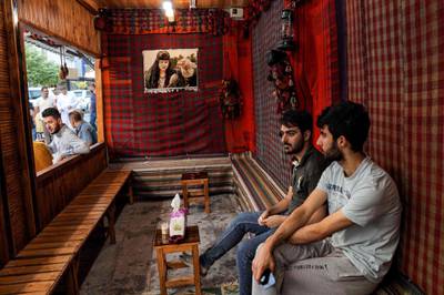 Men sit at a traditional cafe in the historic city of Shaqlawah, about 48 kilometres northeast of Erbil, in the northern Iraqi Kurdish autonomous region.  AFP