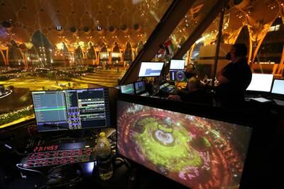 Technical teams run through the sequence of light and sound that lend an element of theatre to performances at Al Wasl dome. Pawan Singh / The National  