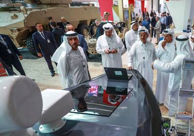 Abu Dhabi, U.A.E., February 20, 2019. INTERNATIONAL DEFENCE EXHIBITION AND CONFERENCE  2019 (IDEX) Day 4--  Chairman of Al Habtoor Group, Khalaf Al Habtoor (3rd from right)visits IDEX on the fourth day of the exhibition as seen here checking out  the M300 High Speed Patrol & Strike USV.Victor Besa/The NationalSection:  NA