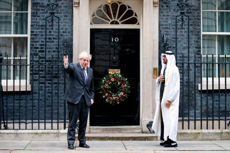 British Prime Minister Boris Johnson (l) extends a warm welcome to Crown Prince of Abu Dhabi and Deputy Supreme Commander of the Armed Forces, Sheikh Mohamed bin Zayed, outside 10 Downing Street, London. AFP