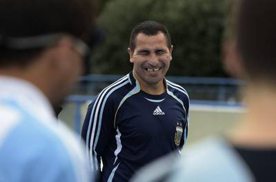 Silvio Velo (C) smiles during a training session in Buenos Aires. Juan Mabromata / AFP