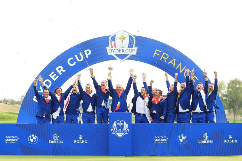Captain Thomas Bjorn  lifts The Ryder Cup as Europe celebrates victory. Getty Images