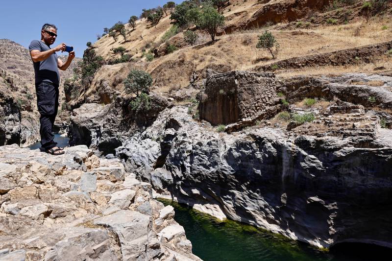 Nabil Musa taking pictures of the Sirwan River on the outskirts of Halabja, Iraq. Reuters
