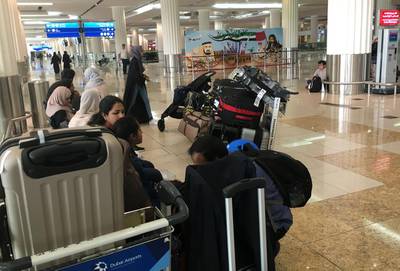 Indian passengers wait for their flight at the departure lounge at Dubai International Airport. Karim Sahib / AFP