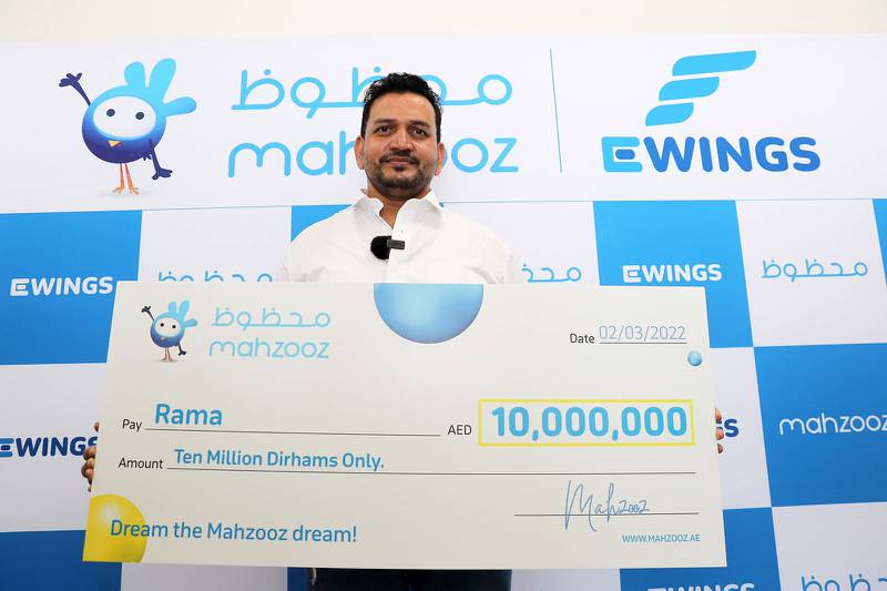 Mahzooz draw winner Rama with his cheque for Dh10 million. Photo: Pawan Singh / The National