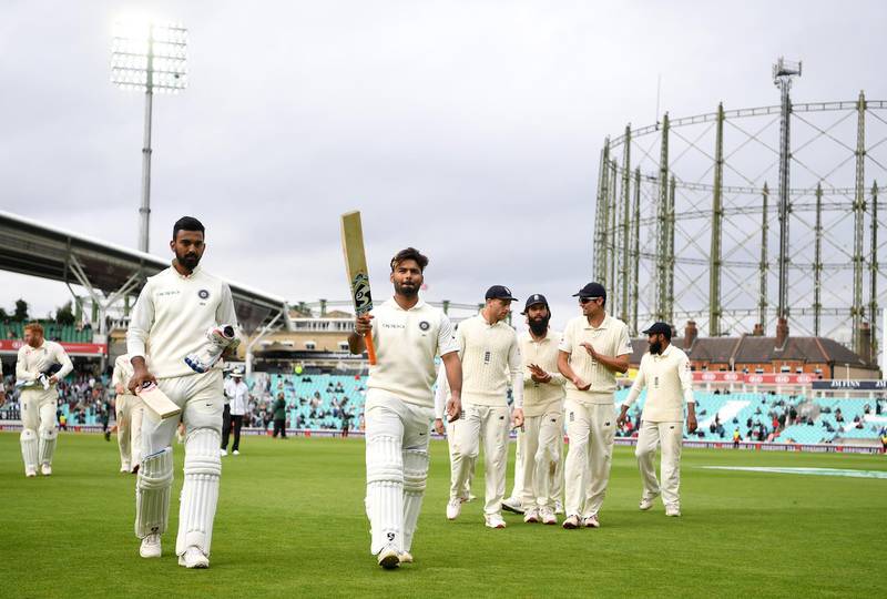 LONDON, ENGLAND - SEPTEMBER 11:  Rishabh Pant and Lokesh Rahul of India salute the crowd as they leave the field at tea during day five of the Specsavers 5th Test match between England and India at The Kia Oval on September 11, 2018 in London, England.  (Photo by Gareth Copley/Getty Images)