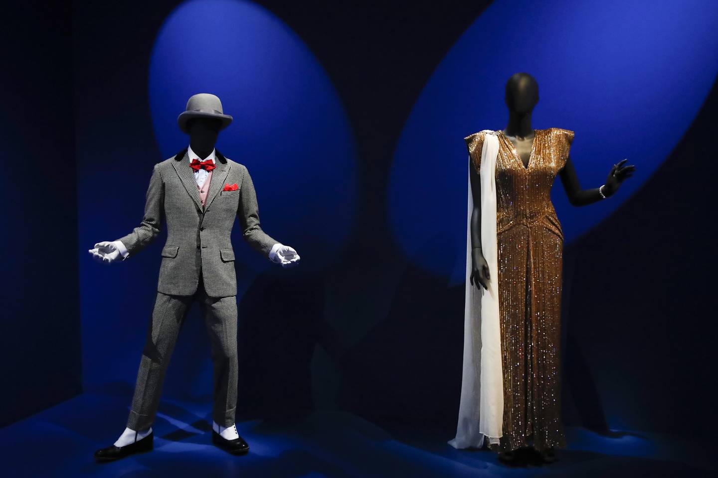Left, a costume worn by Sammy Davis Jr in the film 'Porgy and Bess'; right, a costume worn by Lena Horne in the film 'Stormy Weather'. EPA