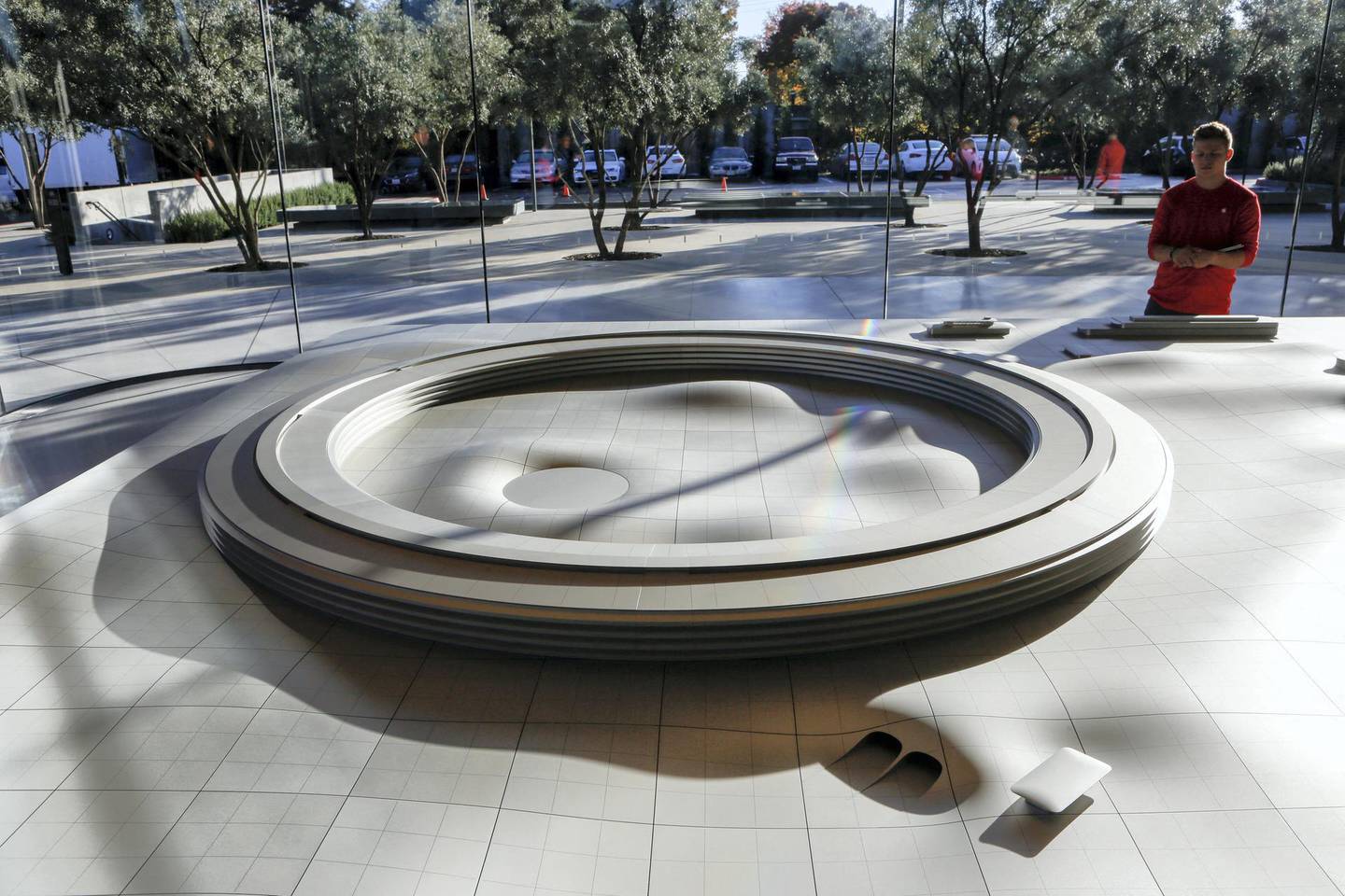 An aluminum alloy model with augmented reality showing the finished Apple Park is displayed at the Apple Park Visitor Center on November 17, 2017 in Cupertino, California. (Photo by Amy Osborne / AFP)