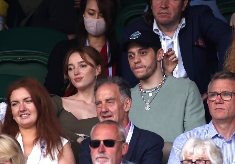 British actress Phoebe Dynevor and Pete Davidson watch a match at centre court on day six of Wimbledon at The All England Lawn Tennis and Croquet Club, Wimbledon. The National