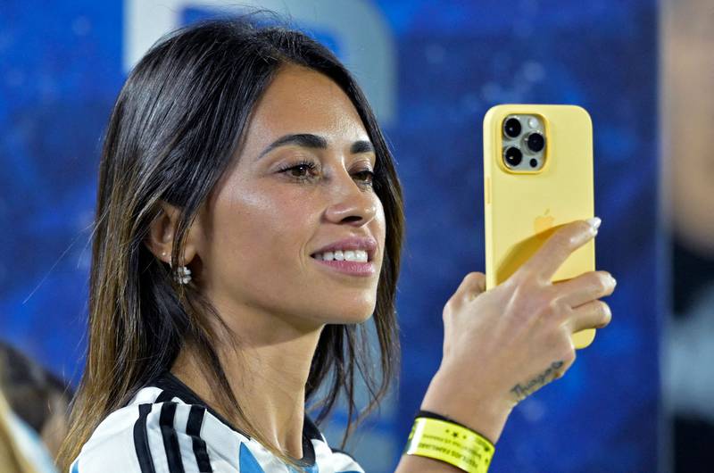 The wife of Argentina's forward Lionel Messi, Antonela Roccuzzo, films with her mobile phone before the friendly football match against Panama, at the Monumental stadium in Buenos Aires. AFP