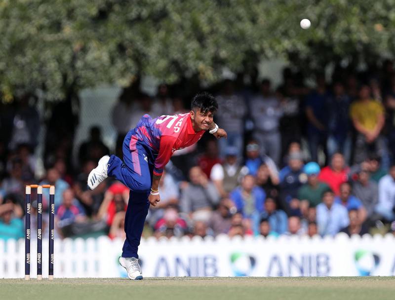 Dubai, United Arab Emirates - January 25, 2019: Sandeep Lamichhane of Nepal bowls in the the match between the UAE and Nepal in a one day internationl. Friday, January 25th, 2019 at ICC, Dubai. Chris Whiteoak/The National