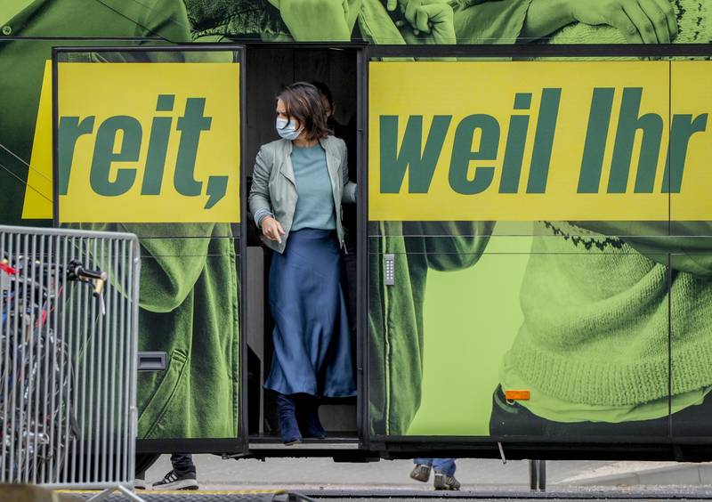 Annalena Baerbock leaves the Greens' campaign bus during an event in Mainz. Photo: AP