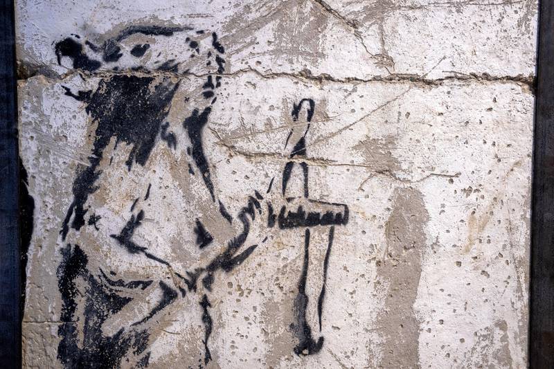The painting of a slingshot-toting rat once stood near Israel's separation barrier and was one of several works created in 2007 by the British graffiti artist. 