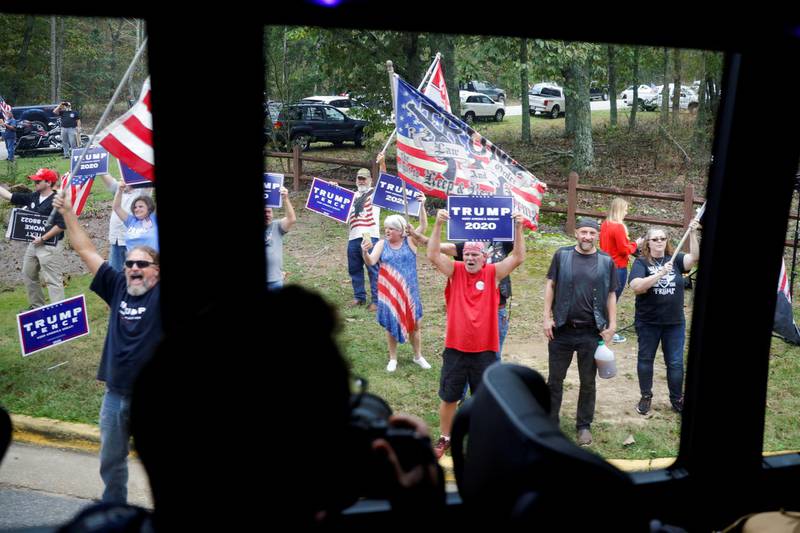 Supporters of U.S. President Donald Trump are seen through a bus window in the motorcade of Democratic U.S. presidential nominee and former Vice President Joe Biden as Biden arrives for a campaign stop in Warm Springs, Georgia. REUTERS