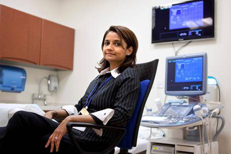 United Arab Emirates, Abu Dhabi, Feb. 7, 2012: Dr. Gowri Ramanathan, a foetal medicine specialist and consultant obstetric gynecologist, scans a patient's belly for an ultrasound during their consultation, which included a discussion about a possibility of a cesarean section in lieu of a natural delivery at the Corniche Hospital in Abu Dhabi. (Silvia Razgova / The National)
